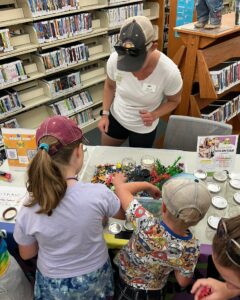 Library patrons complete hands-on activity.